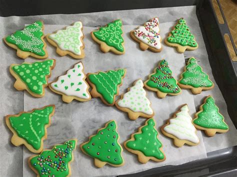 I added vanilla extract instead of almond extract. Christmas tree cookies | Christmas tree cookies, Christmas cookies, Royal icing cookies