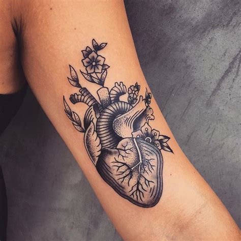 anatomical heart flowers tattoo by andrea revenant traditional heart tattoos anatomical heart