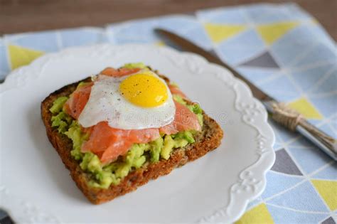 Sandwich With Avocado Smoked Salmon And Quail Egg Stock Photo Image