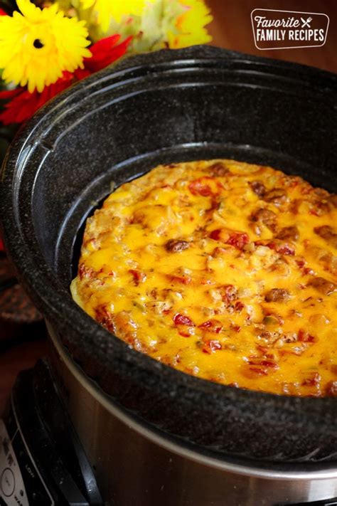 Overnight crockpot breakfast casserole is a classic breakfast casserole that's easy to make with eggs, sausage, bacon, hash browns, and cheese. Crock Pot Breakfast Casserole | Favorite Family Recipes