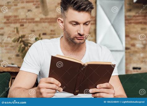 Focus Of Handsome Man Reading Book Stock Image Image Of Handsome