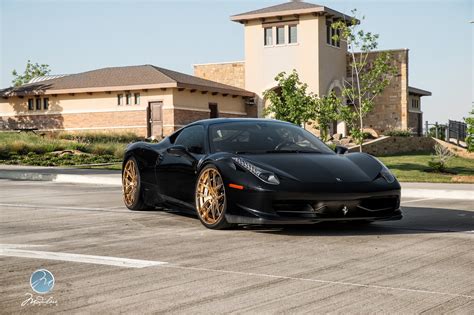 1163, modena, italy, companies' register of modena, vat and tax number 00159560366 and share capital of euro 20,260,000 Black Ferrari 458 Italia With Golden Modulare Wheels - GTspirit