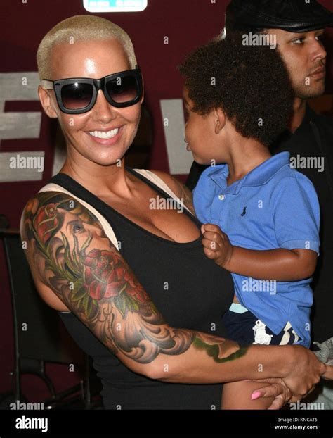 LOS ANGELES CA JULY Amber Rose Showers Her Son Sebastian Affection As She Carries His Toy