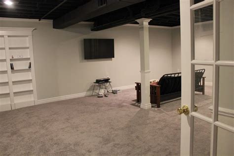 Basement Remodel With Painted Exposed Ceiling