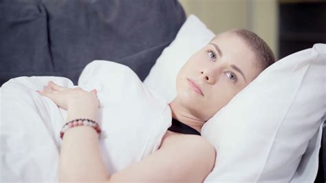 Portrait Of Desperate Young Woman Having Cancer Lying On Couch Thinking Tired Young Frustrated