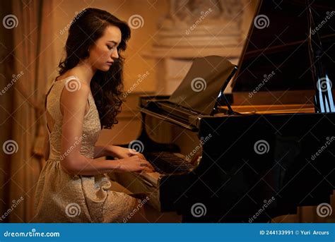 Its Just Her And The Piano Shot Of A Beautiful Young Woman Playing The
