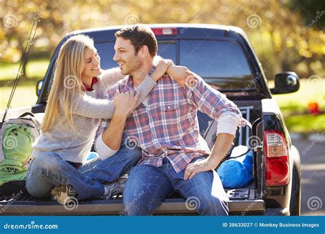 Couple Sitting In Pick Up Truck On Camping Holiday Stock Image Image