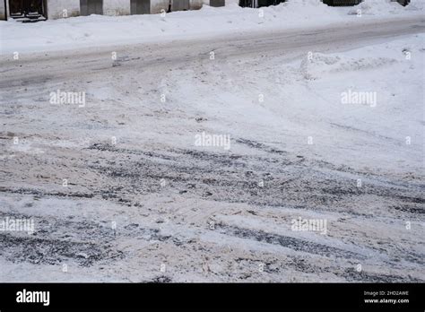 Slippery Snowy City Road During Winter Difficult Weather Conditions