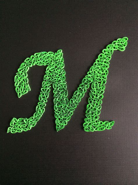 I'm sure there's someone in your life who would love to… Quilled letter M | Manualidades, Manualidades geniales
