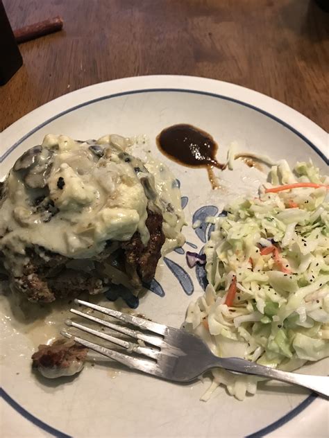 Mushroom and onion stuffed grilled burger with slaw and A1