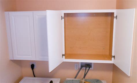 Attach a cabinet to concrete walls with help from a kitchen cabinet. Installing Wall Cabinets In Laundry Room | online information