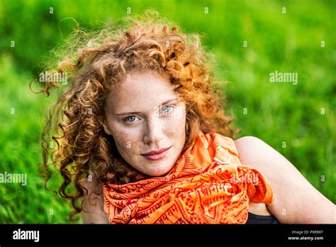 Portrait Of Freckled Young Woman With Curly Red Hair Hi Res Stock