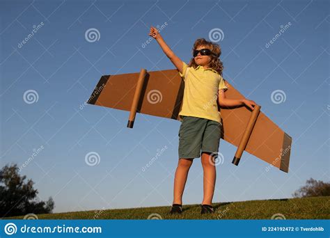 Kid Superhero With Jetpack Boy Pilot Against A Blue Sky Child Pilot