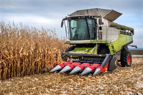Premium Photo Combine Harvester Working In A Corn Field During Harvest