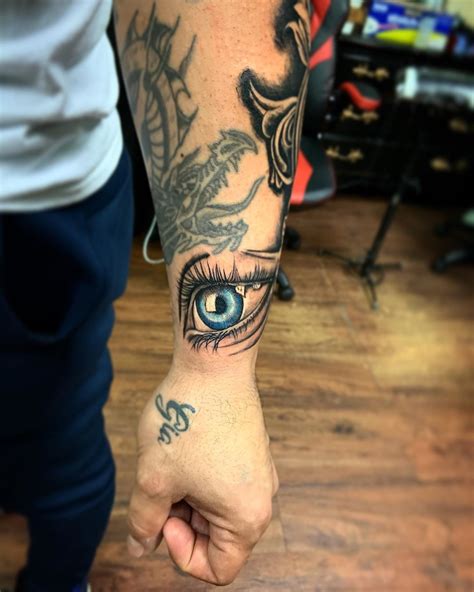 Realistic Blue Eye On Wrist Tattoo By Izzy Garcia