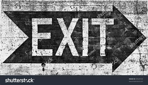 Large Grungy Exit Sign Painted On Rough Heavily Textured Concrete Wall