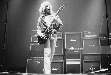 Rick Parfitt Of Status Quo Performs On Stage In Front Of A Stack Of