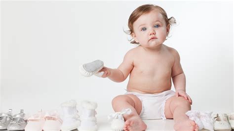 Cute Baby Is Playing With Footwears In White Background Hd