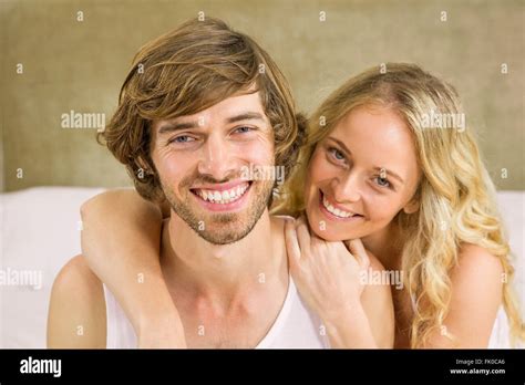 Cute Couple Cuddling On Their Bed Stock Photo Alamy