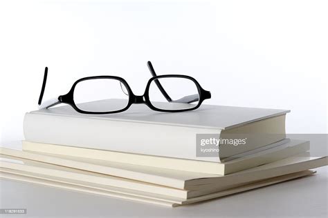 Stacked White Blank Books With Glasses On White Background High Res