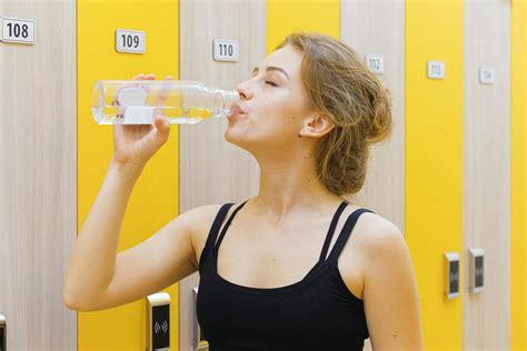 Woman In Black Tank Top Drinking Water · Free Stock Photo