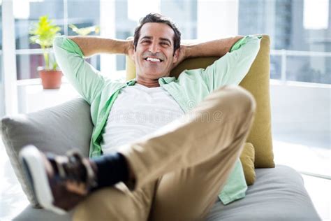 Happy Man Relaxing On Sofa At Home Stock Image Image Of Leisure