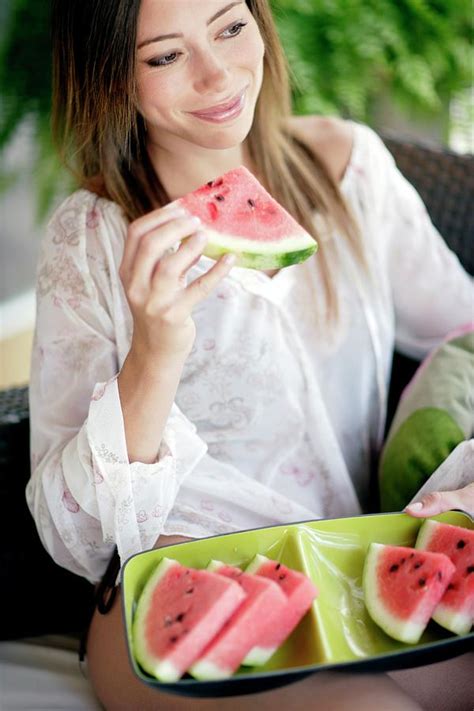 Woman Eating Watermelon Photograph By Ian Hooton Science Photo Library