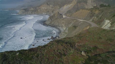 5k Aerial Video Fly Low Over Waves Slamming Into Coastal Cliffs Big