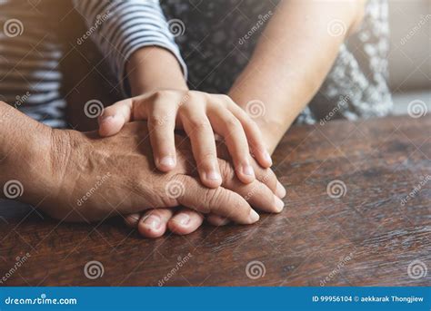 Close Up Of Senior And Kid Join Hands Stock Photo Image Of Diversity