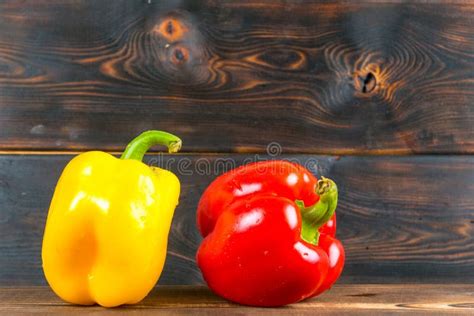 Red And Yellow Bell Peppers On Wooden Background Stock Image Image Of