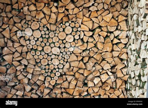 Woodpile Of Air Dried Homegrown Hardwood Firewood With Heart Shape