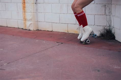 Free Photo Low Section Of Female Skater Balancing On Roller Skate