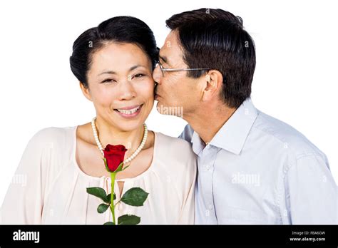 Older Asian Couple With Rose Stock Photo Alamy