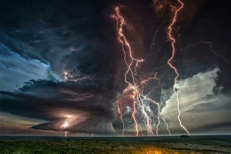 Lightning Strikes In The Sky Over An Open Field