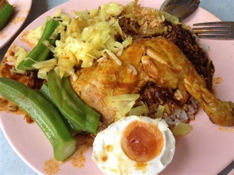 Nasi kandar is a iconic food synonymous with penang island, malaysia. Malaysian Nasi Kandar