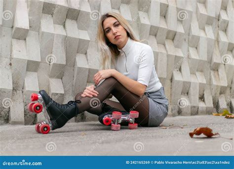 Blonde Girl Wearing A Skirt And Black Roller Skates With Red Wheels Stock Image Image Of
