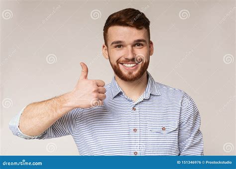 Young Man Showing Thumb Up And Smiling On Camera Stock Photo Image Of