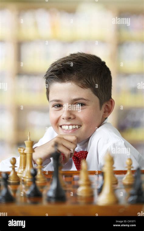 Smiling Boy Playing Chess Stock Photo Alamy
