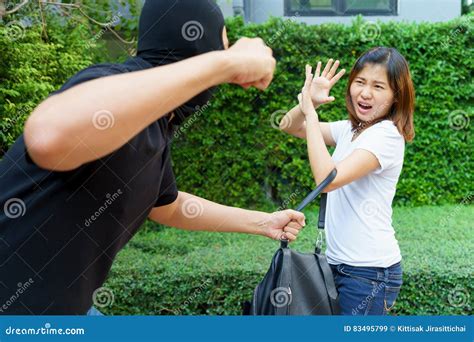 thief fighting and stealing handbag from screaming asian woman a stock image image of steal