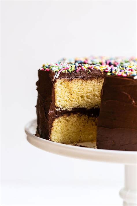 This combination gives you a light . Yellow Layer Cake with Chocolate Frosting on a cake stand ...