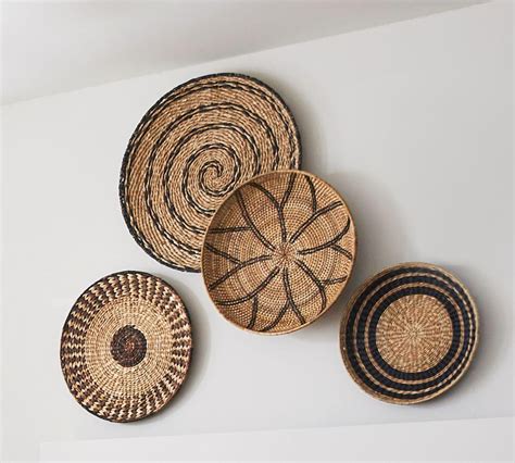 A scribble of natural rattan spirals this organic piece of wall art. Woven Baskets Wall Art | Pottery Barn Australia