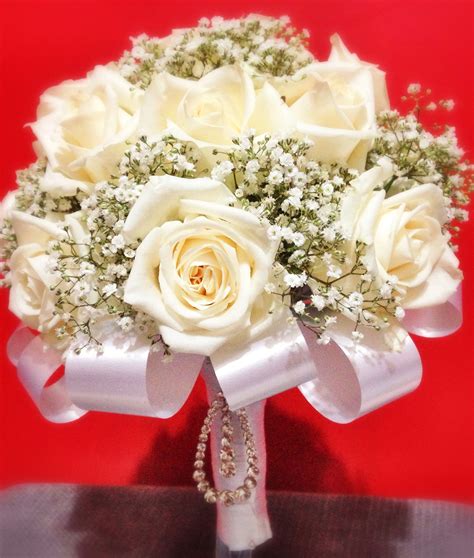 Simple wedding bouquets are an emerging trend in the bridal industry as more couples prefer an elegant, understated celebration rather than the elaborate. White roses & baby's breath bridal bouquet .........For ...