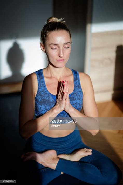 Woman Meditating In Lotus Position High Res Stock Photo Getty Images