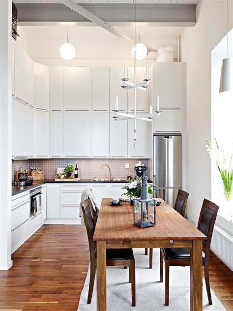 In another crisp space, wooden and metal details make a strong statement. 30 Inspiring White Scandinavian Kitchen Designs