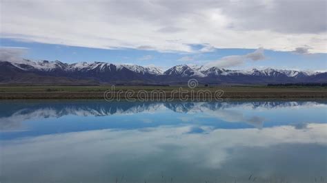 Scenic Landscape Of Snow Mountain And Reflection In New Zealand Stock