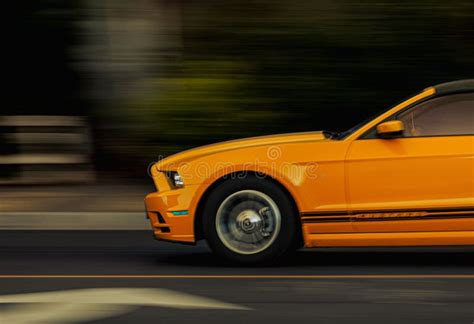 Orange Ford Mustang In Motion Blur On The Road Editorial Stock Image