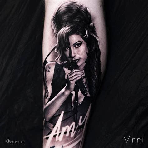 Amy Winehouse Portrait Tattoo Placed On The Shin Black