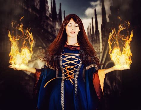 Beautiful Woman Witch In Fantasy Medieval Dress Fire Magic Stock Photo