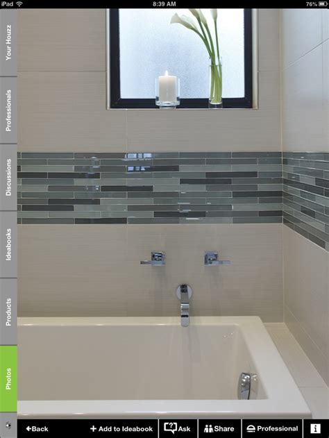 Faux wood tile in bathroom 2021. White and glass tile border | Bathroom | Pinterest