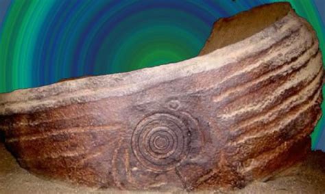 An Ancient Rock With A Spiral Design On Its Face And The Words I Am